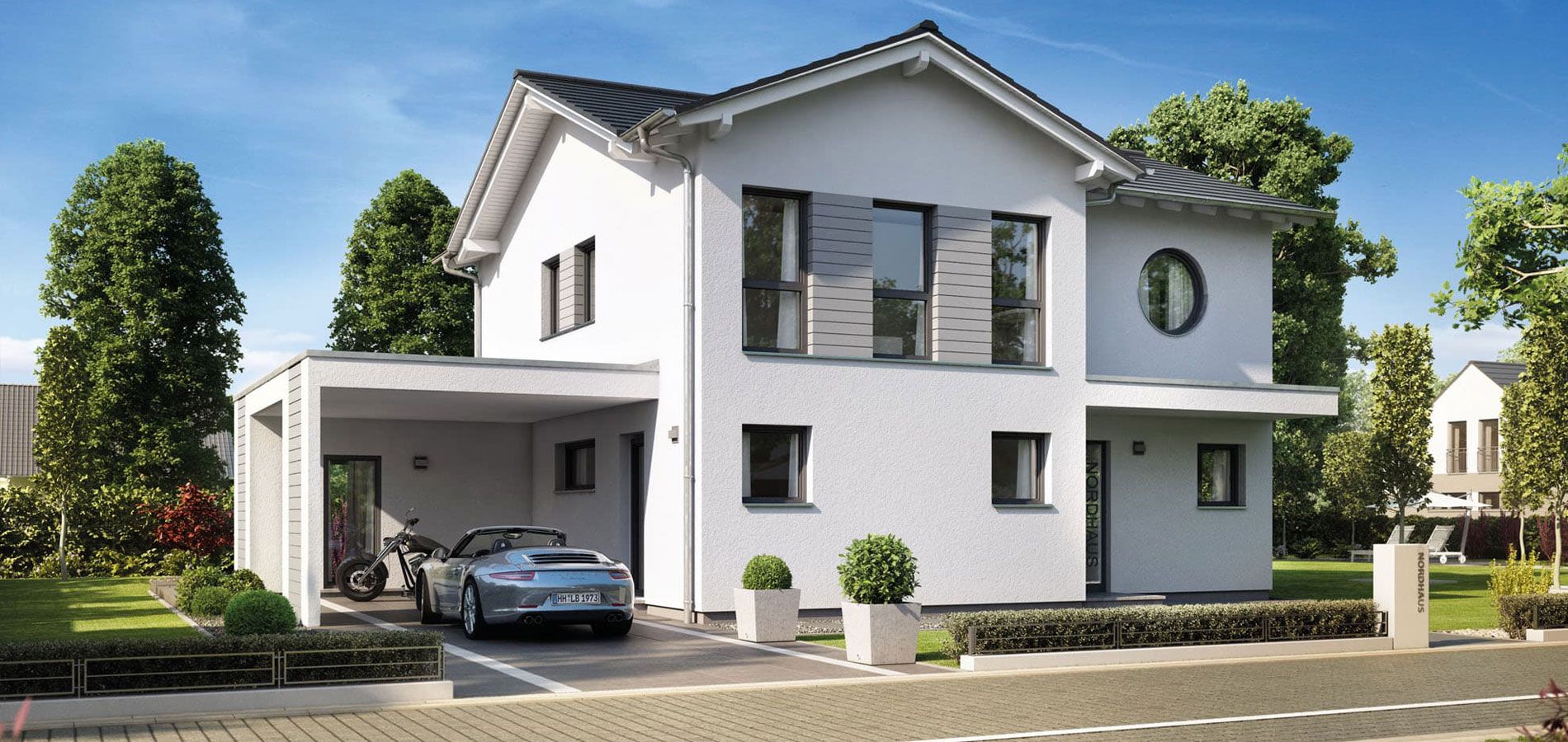 Modernes Fertighaus von Nordhaus mit Carport